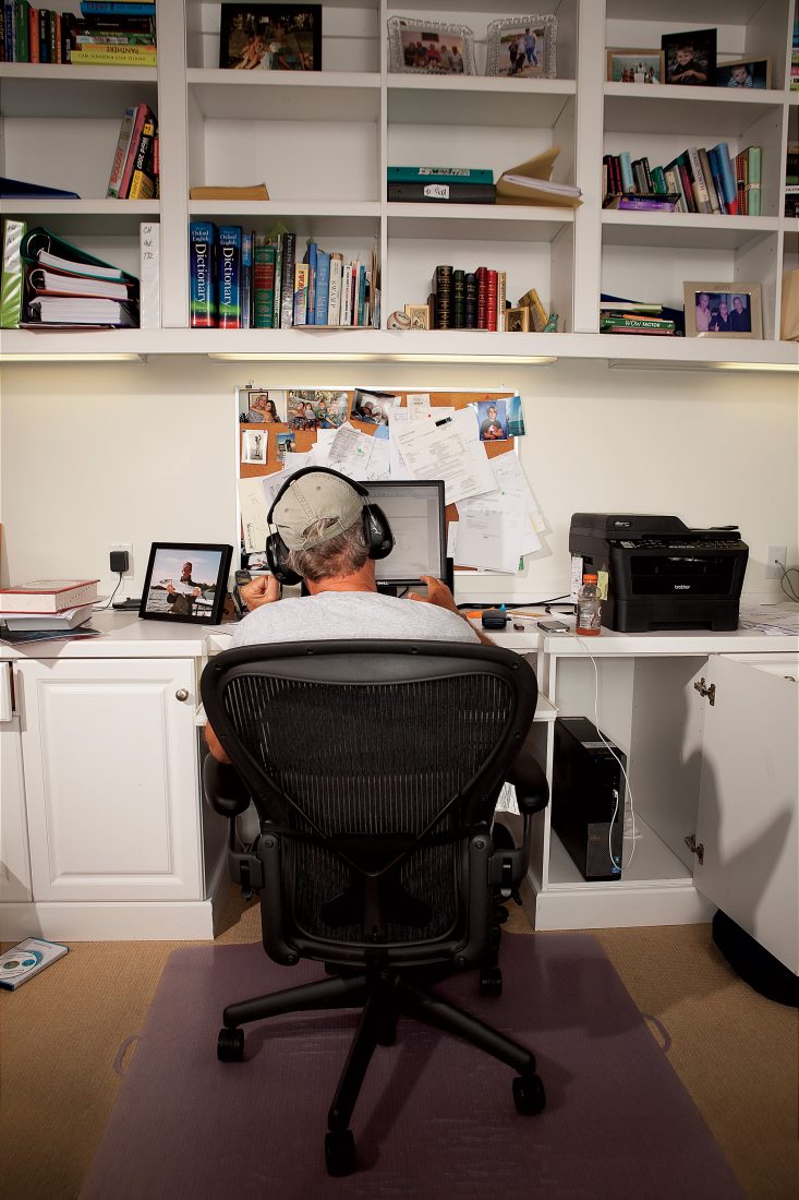 Hiaasen, who likes to write while wearing a pair of earmuffs, at his desk in Vero Beach, Florida.