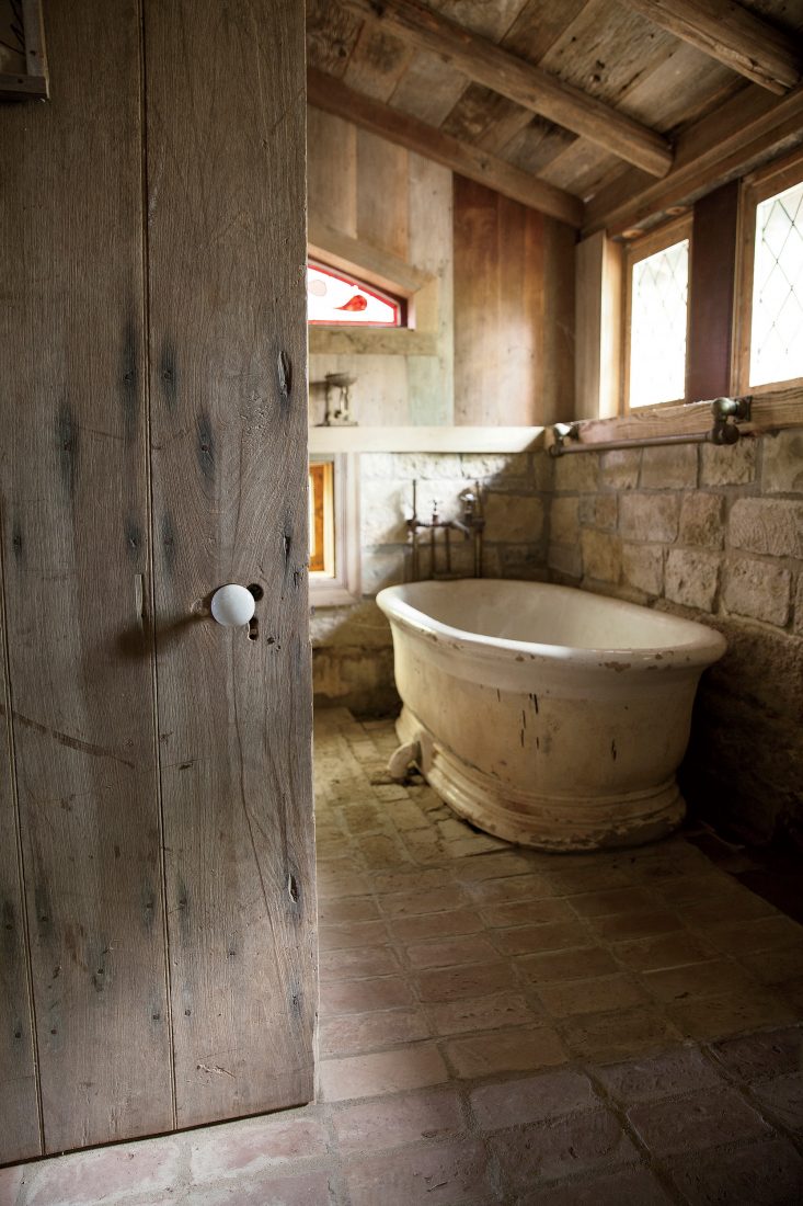 A salvaged bathtub––sent to Dixon by his World War II buddies in Italy––sits on cut Tennessee limestone.