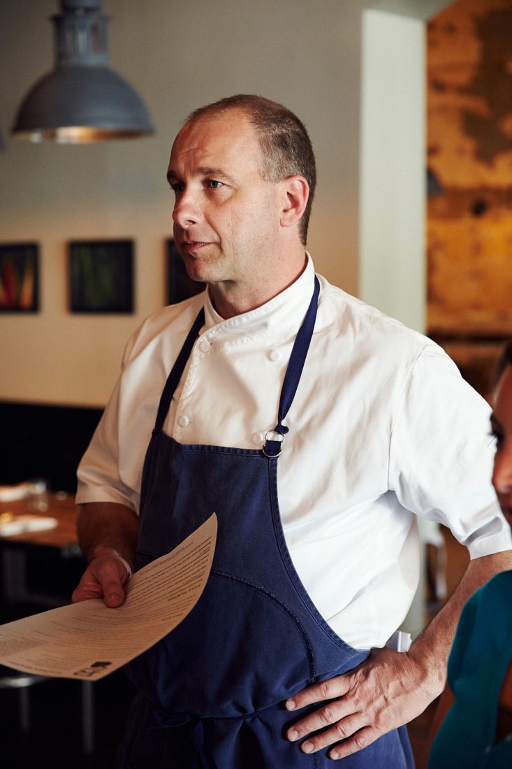 Fleer preps his staff before dinner service.