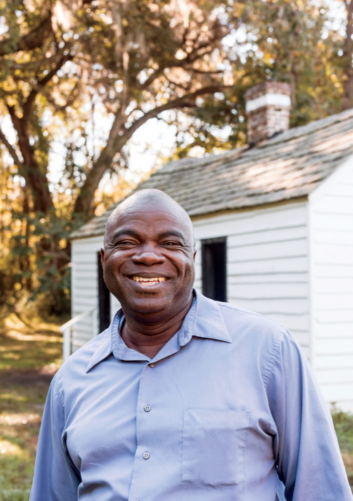 Joseph McGill, Jr., in front of a restored slave cabin at Magnolia Plantation, in Charleston, South Carolina.