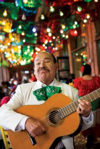 A mariachi serenades diners at downtown Mexican food icon Mi Tierra.