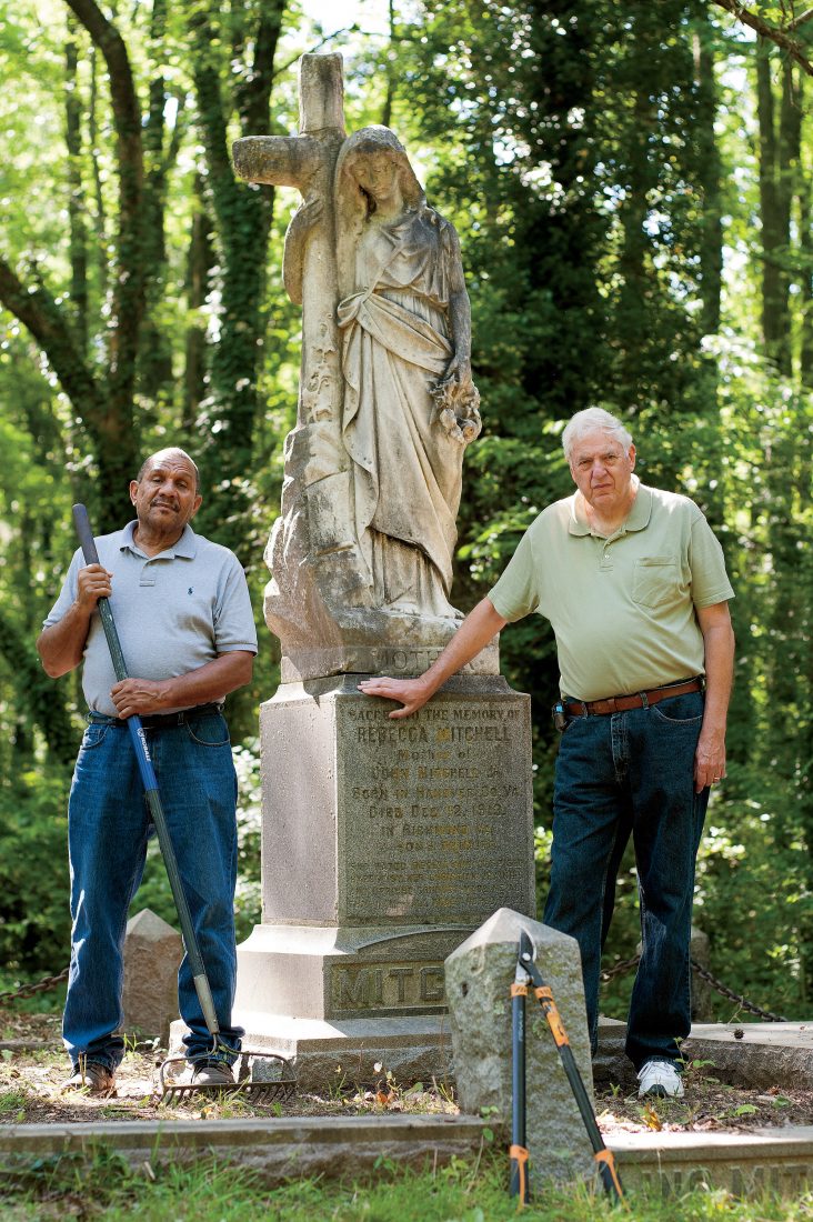 Harris and Shuck stand next to the marker of Rebecca Mitchell, the mother of John Mitchell, Jr. who ran for governor of Virginia in 1921.