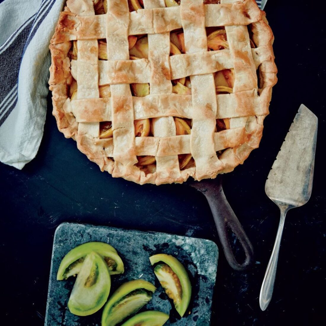 Green Tomato Pie
With a sweet, jammy filling and an old-fashioned buttermilk crust baked in a layer of smoky bacon fat, this is a throwback pie with character.
Get the recipe.