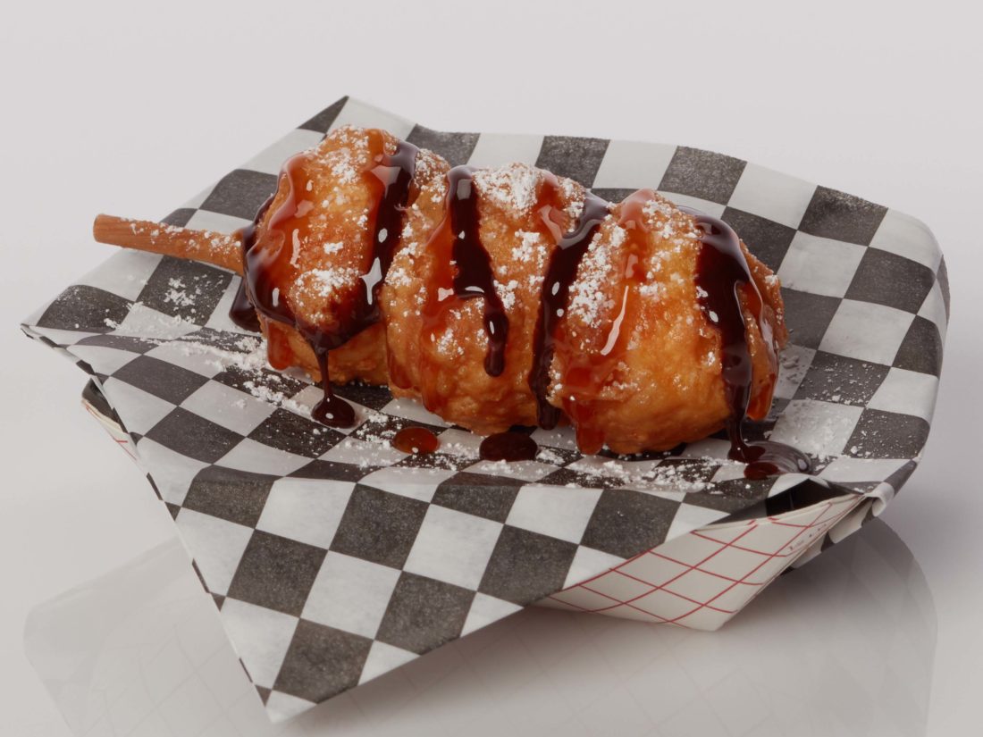 Fat Smooth
Cafe Du Monde beignet batter coats these deep-fried Belgium mini cream puffs, topped with powdered sugar, chocolate drizzle, and caramel sauce.