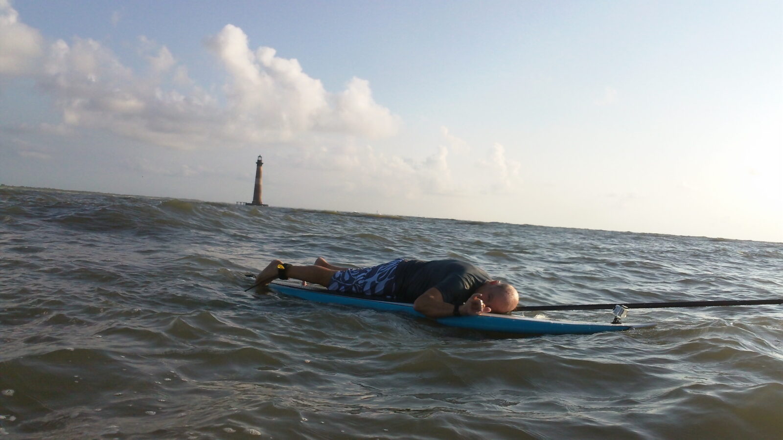 Buffett lays on a paddle board