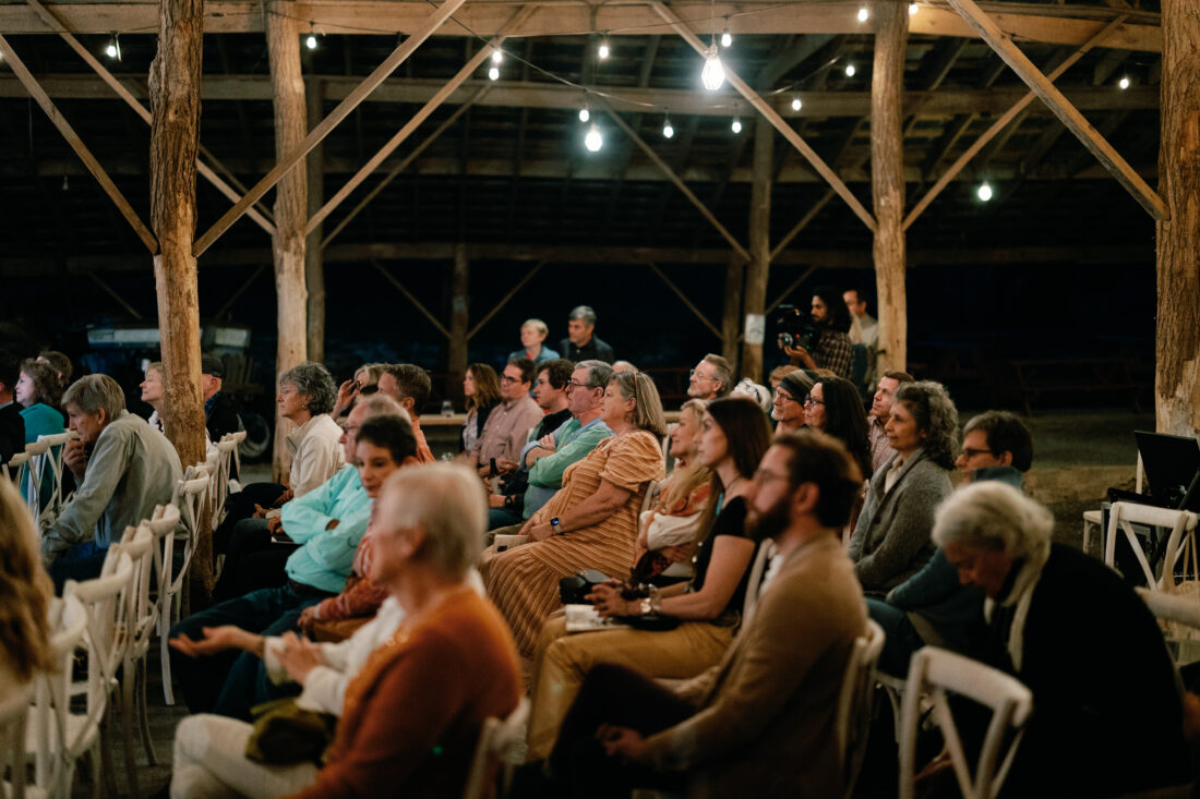 Guests listen to the panel conversation.