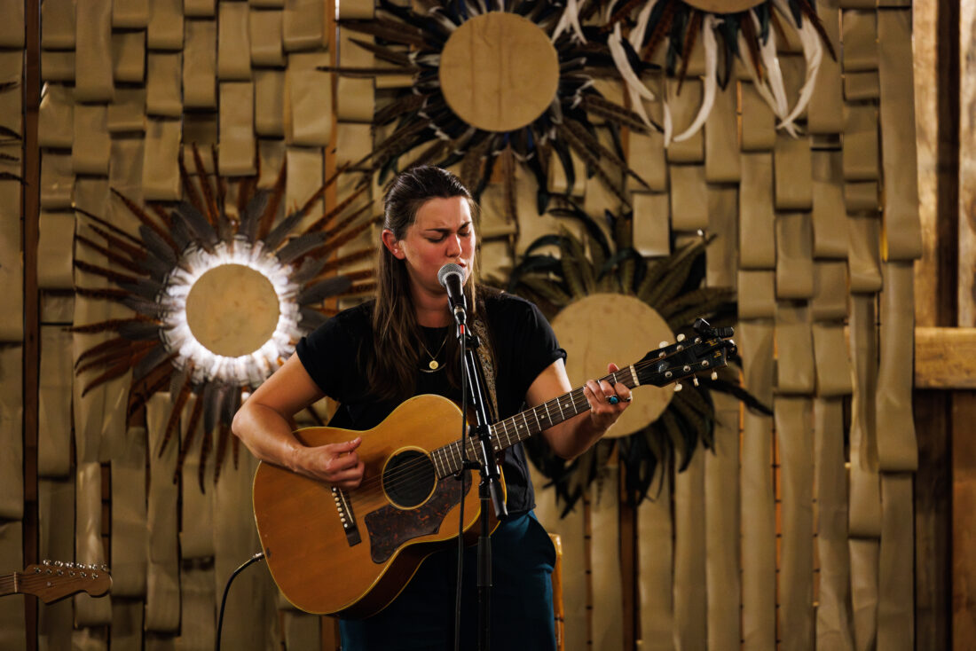 Singer-songwriter Katie Pruitt serenades guests after dessert. 
