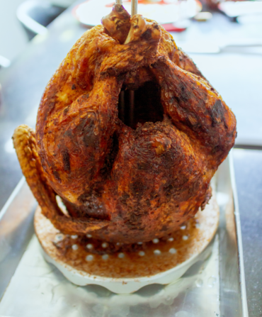 A fried turkey on a stand