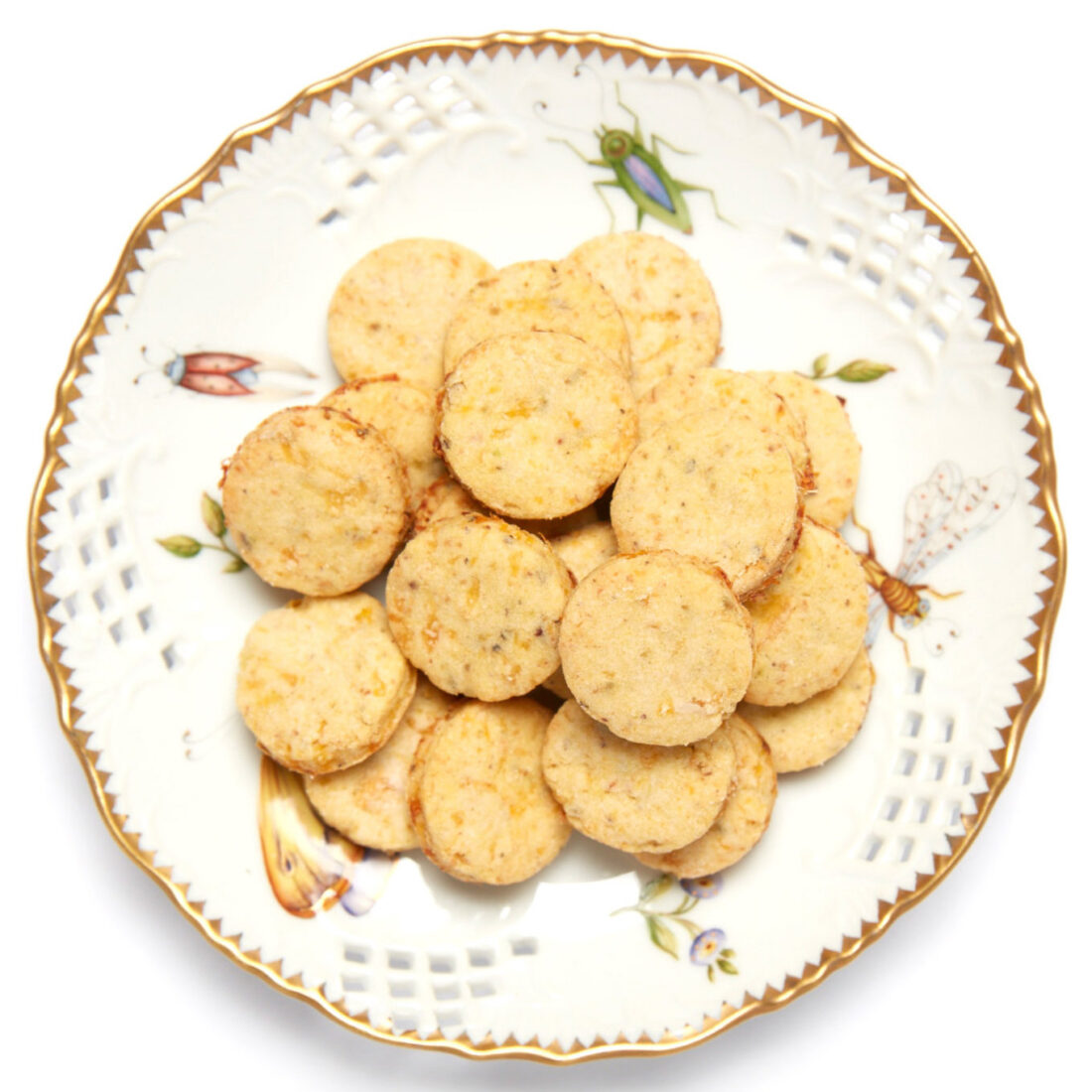 A vintage plate with golden rounds of cookies