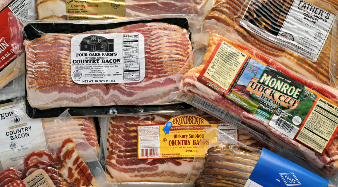 A pile of overlapping packages of bacon
