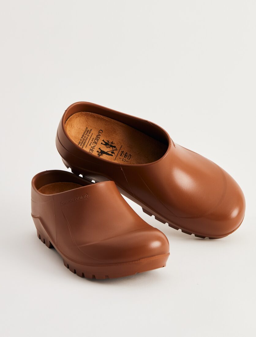 Brown clogs sit on top of each other