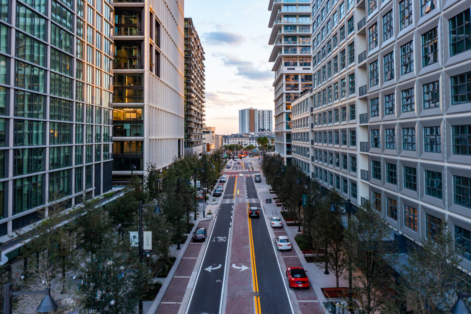 A wide street between city buildings