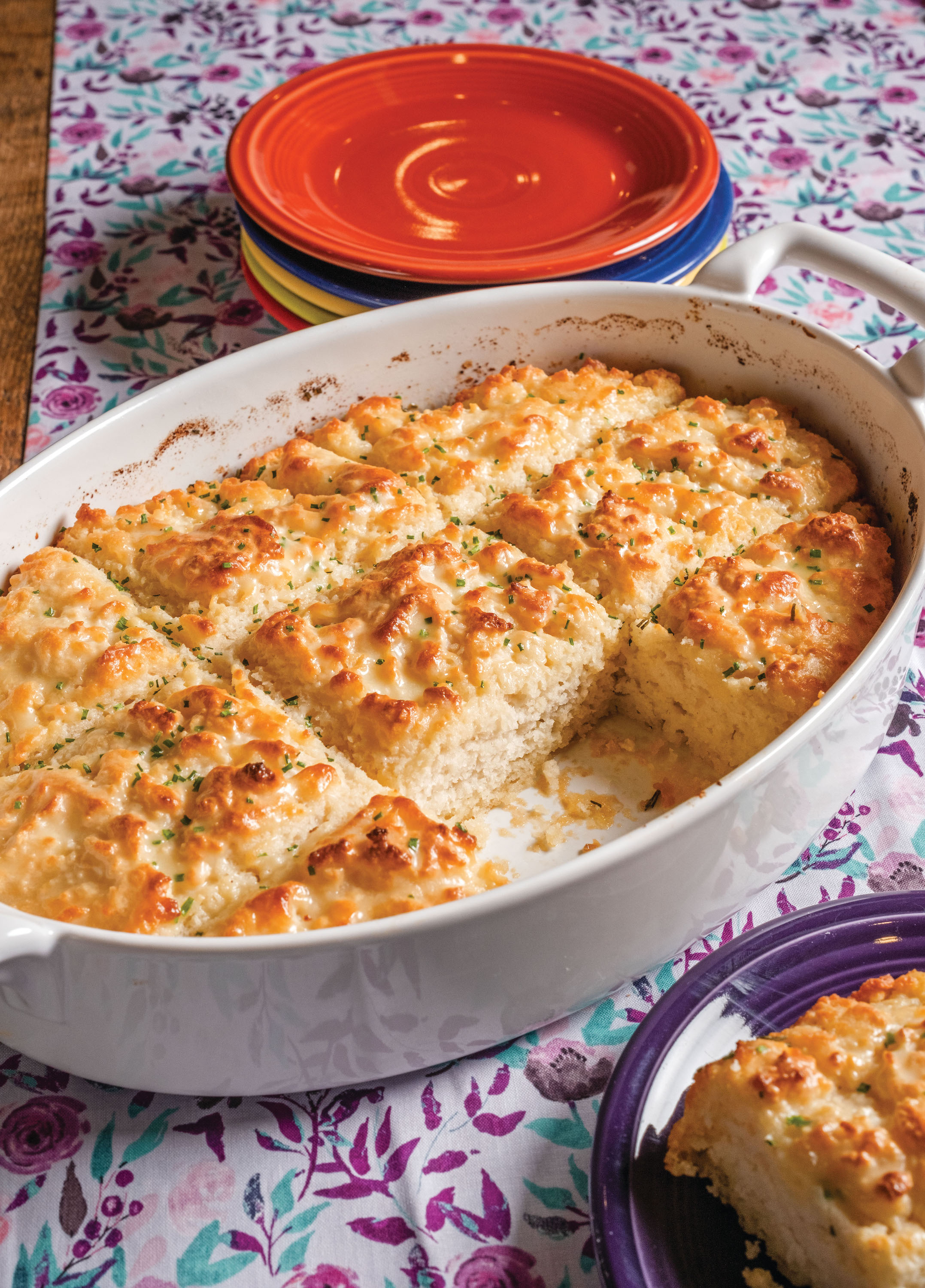 https://gardenandgun.com/wp-content/uploads/2024/01/Rosemary-Garlic-Butter-Bath-Biscuits.jpg