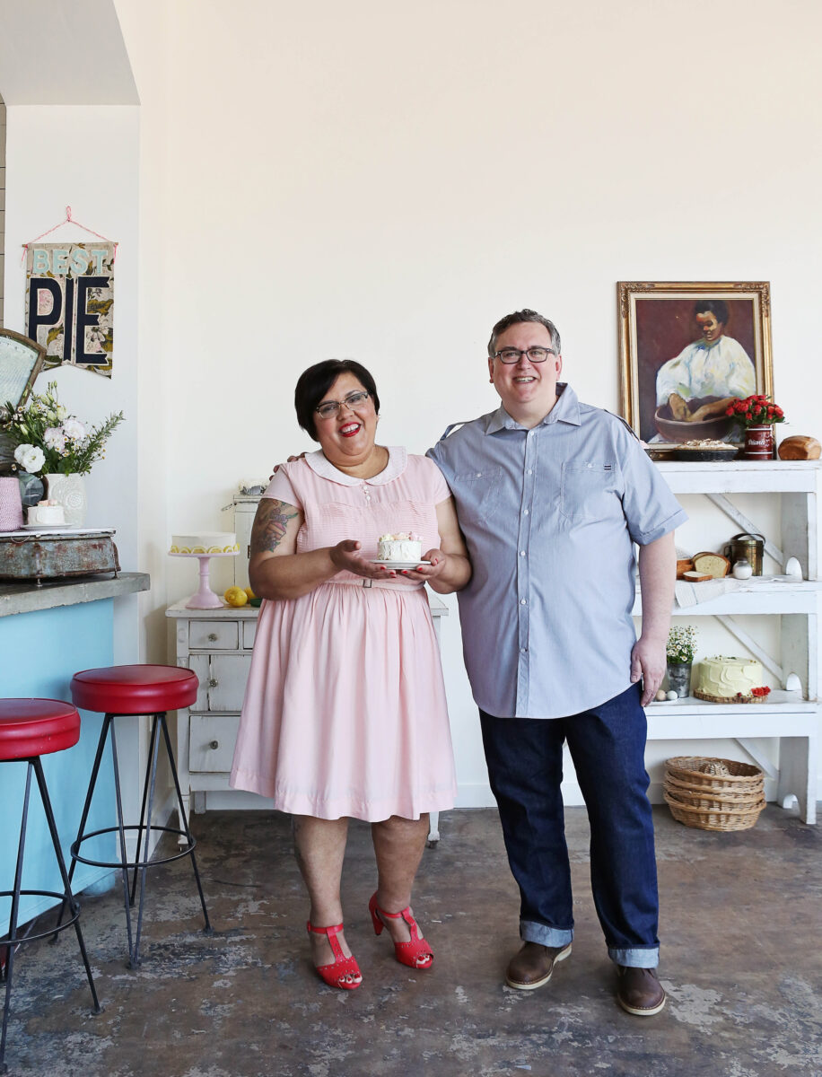 A man and woman stand in a bakery