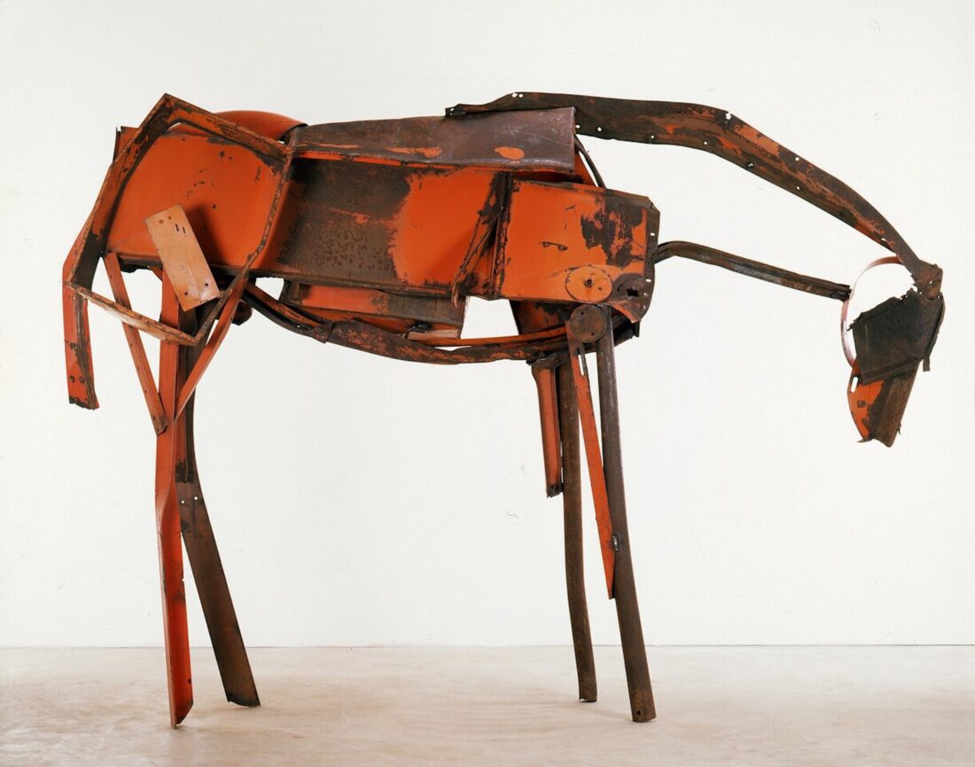 A sculpture of a horse made of steel
