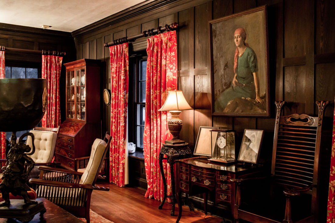 Inside a dark wood room with ornate paneling