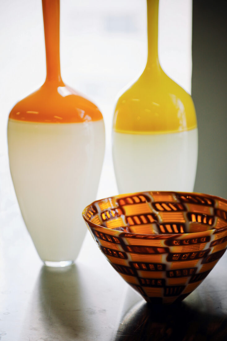 Two blown-glass vases and a basket-weave murrine bowl.
