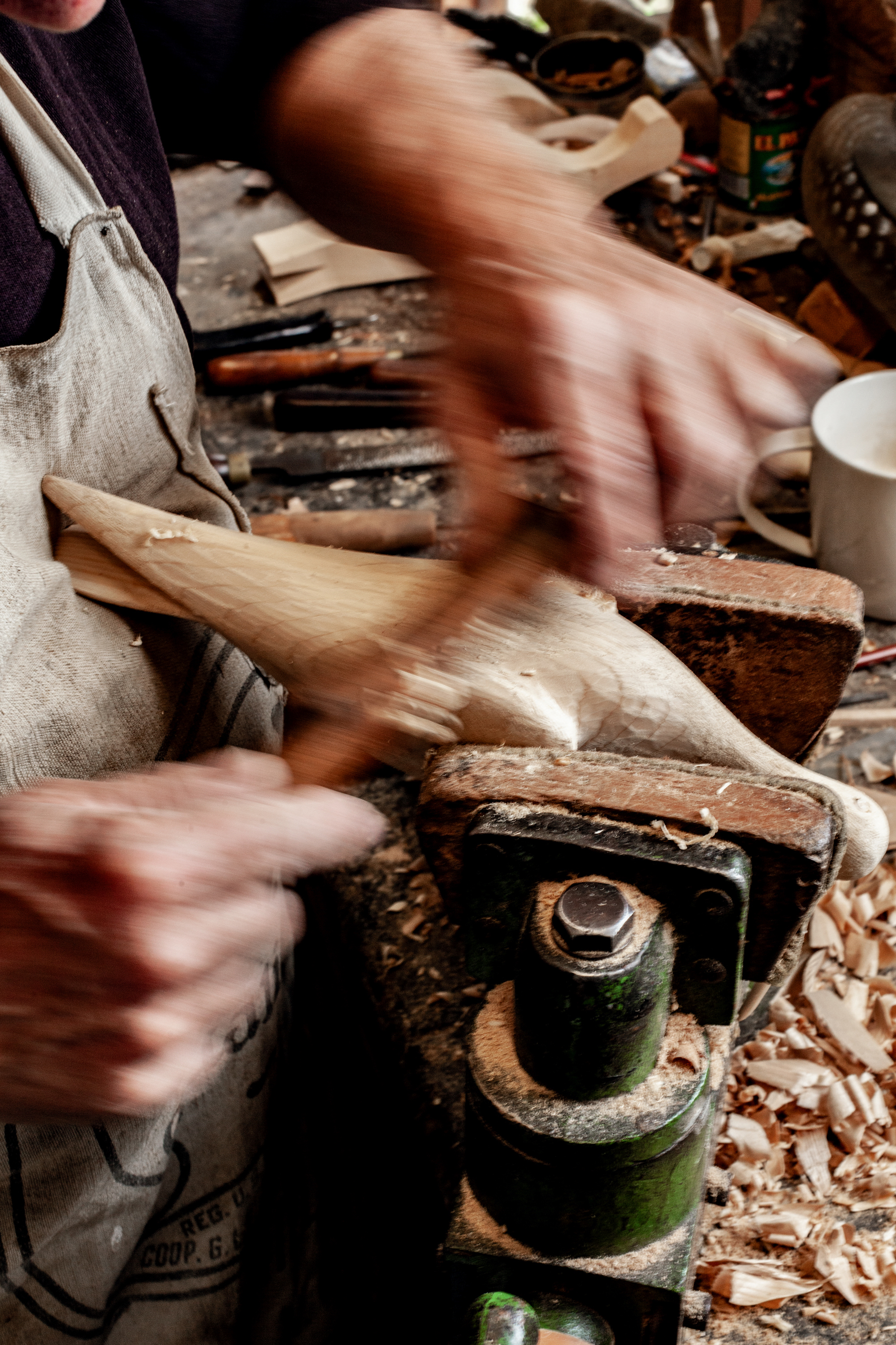 Carving a shorebird with a spokeshave. 