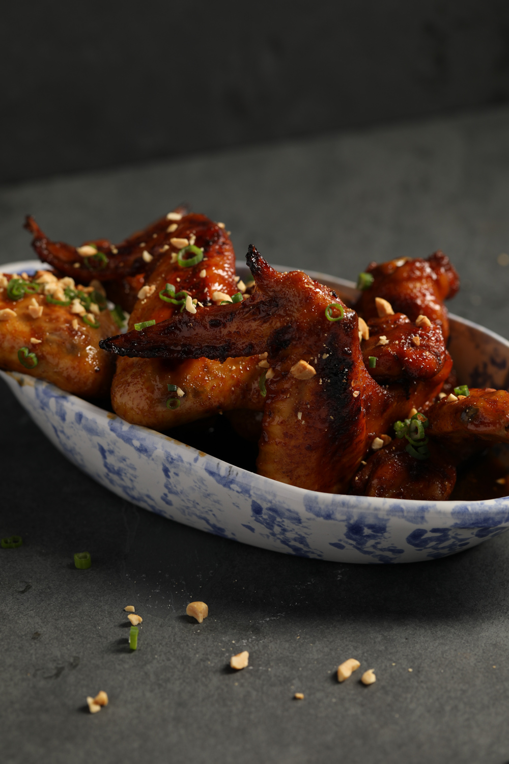 https://gardenandgun.com/wp-content/uploads/2024/04/P.164.-Bourbon-Glazed-Chicken-Wings.-BOURBON-LAND-by-Edward-Lee.jpg?utm_source=chatgpt.com