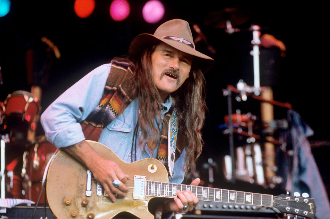 Dickey Betts plays his guitar on stage