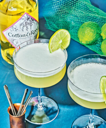 A green cocktail with lime