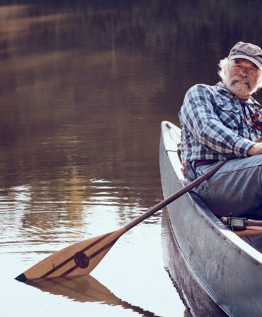 A man sits in a boat