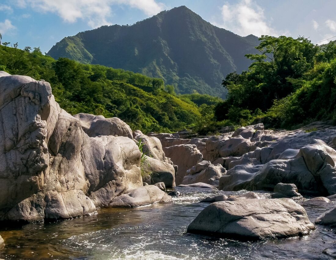 a swimming hole overlooking a mountain