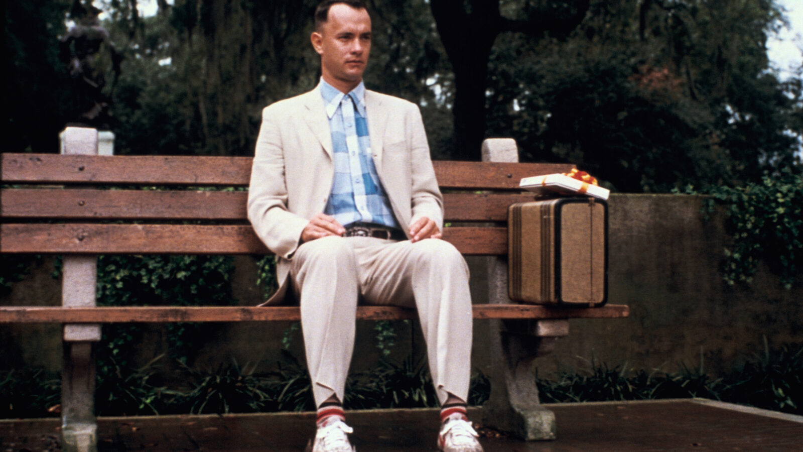 A scene from Forrest Gump showing Forrest sitting on a park bench