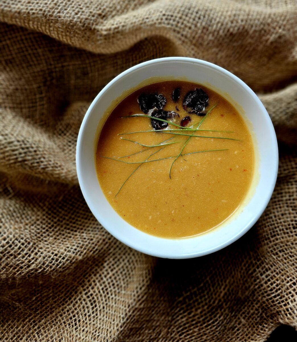 A bowl of yellow soup