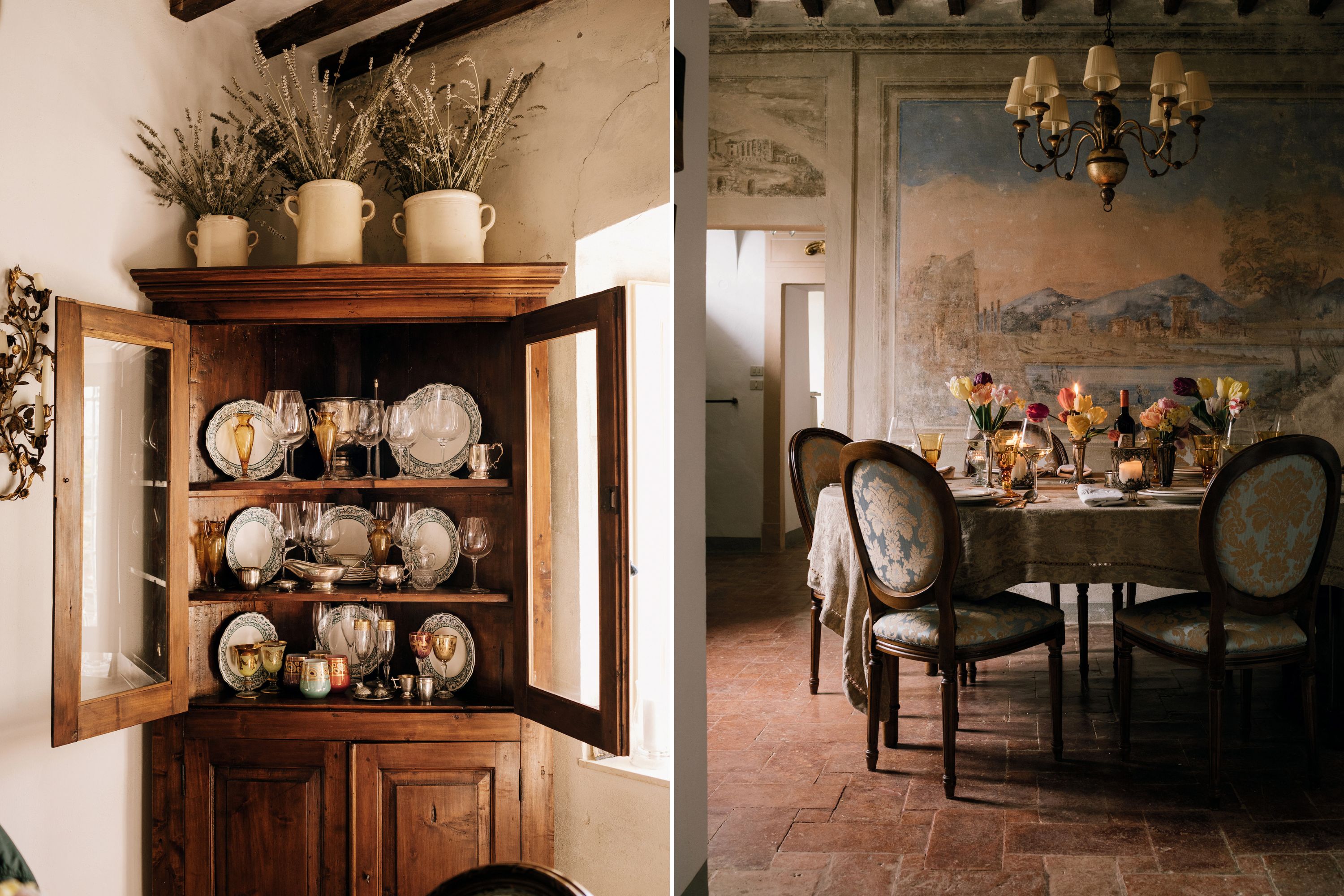 An antique cupboard with vintage glassware; a dining room set for dinner with a fresco on the wall of a mountain landscape.