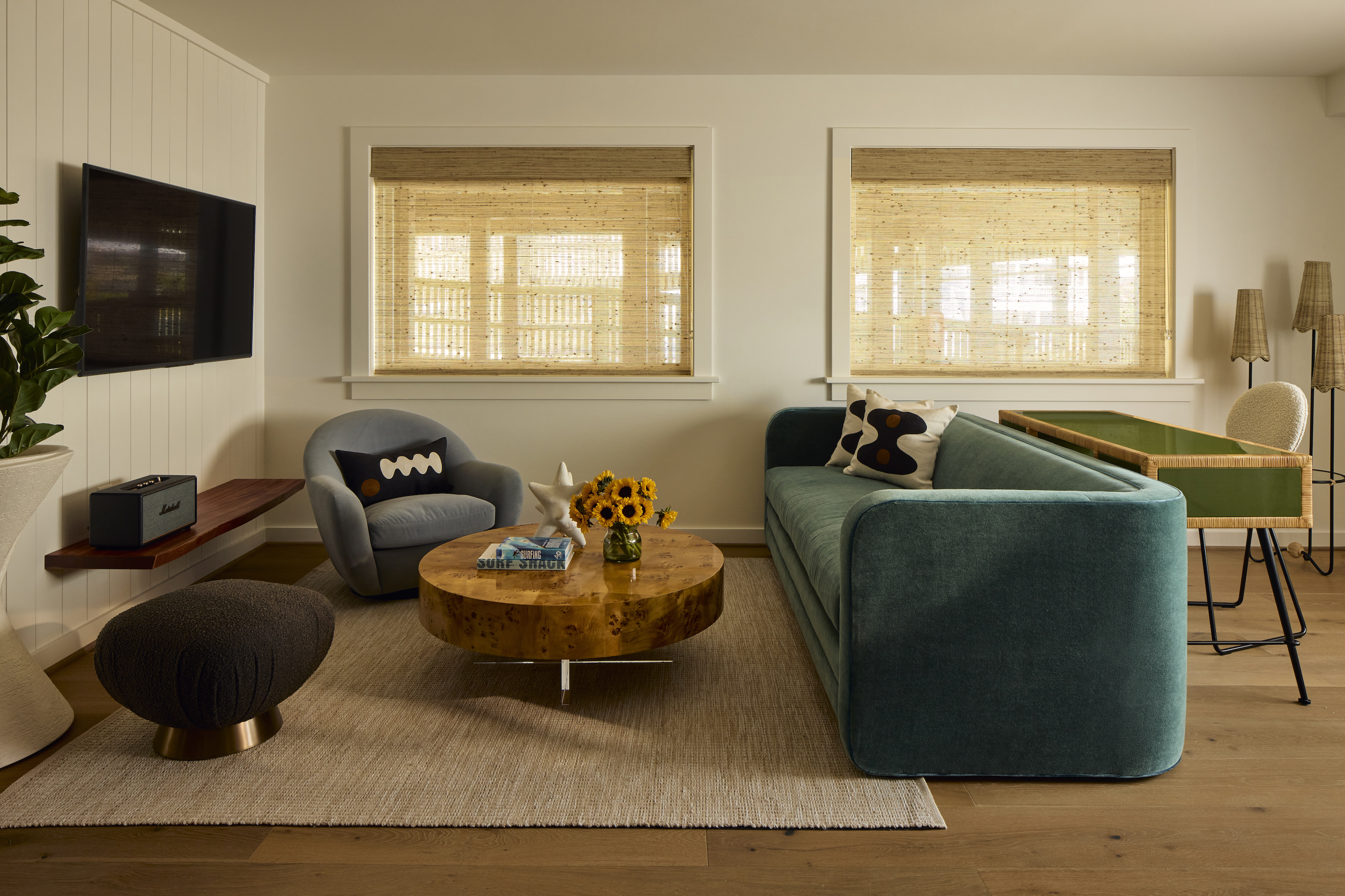 Living room with turquoise velvet sofa