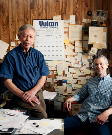 Two men sit in an office