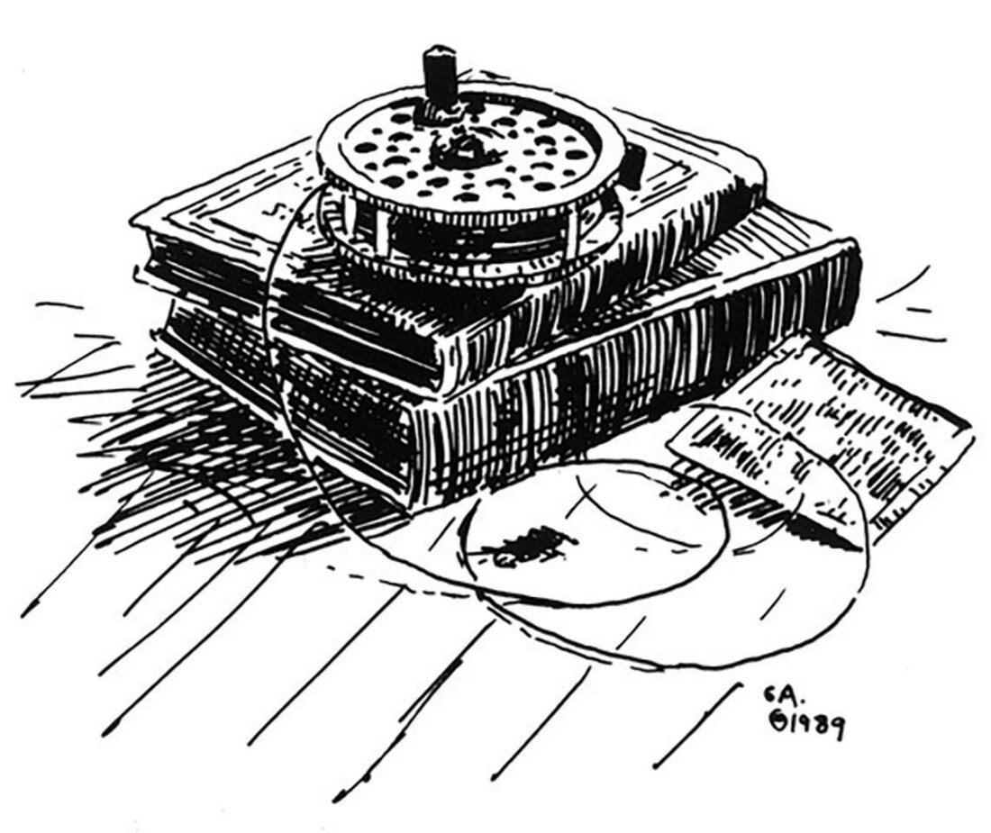 An illustration of a fly rod reel on a stack of books