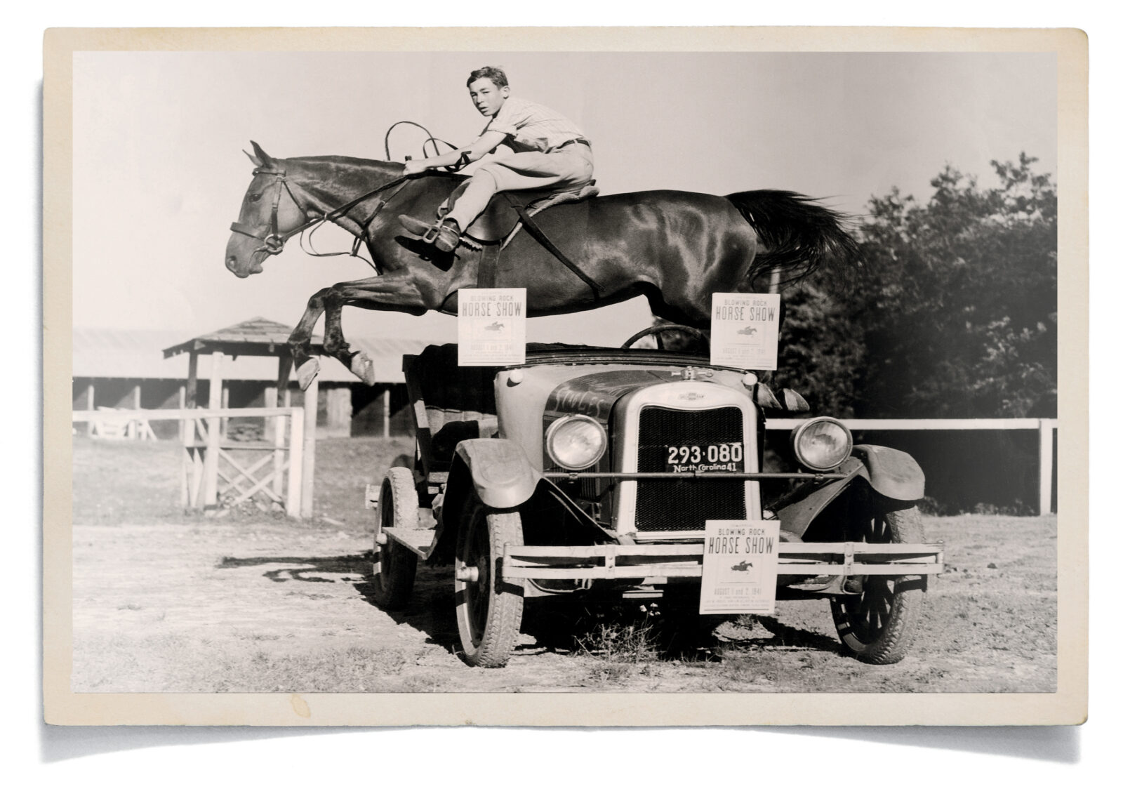 A boy riding a horse jumps over a car
