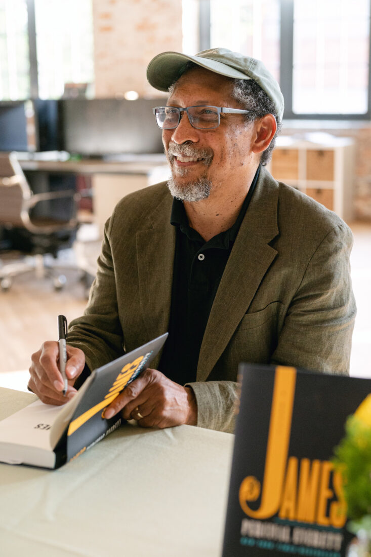 A man signs a book