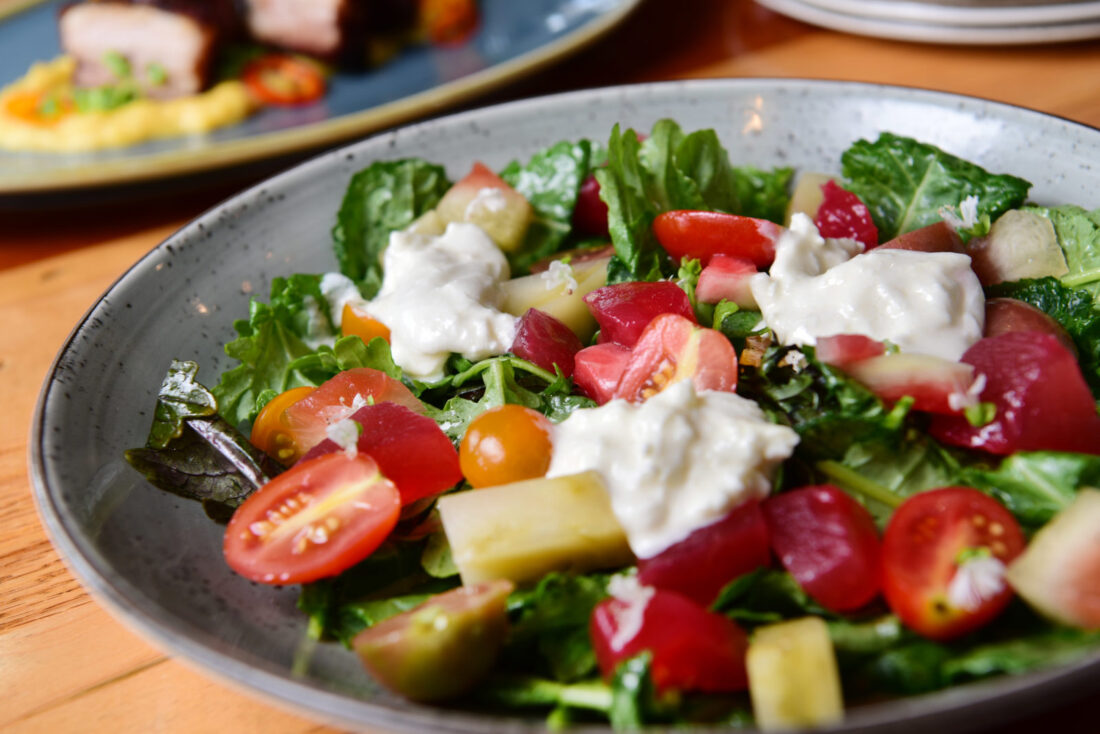 watermelon salad with cherry tomatoes, arugula, and burrata