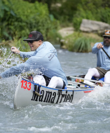 A man kayaks on the river