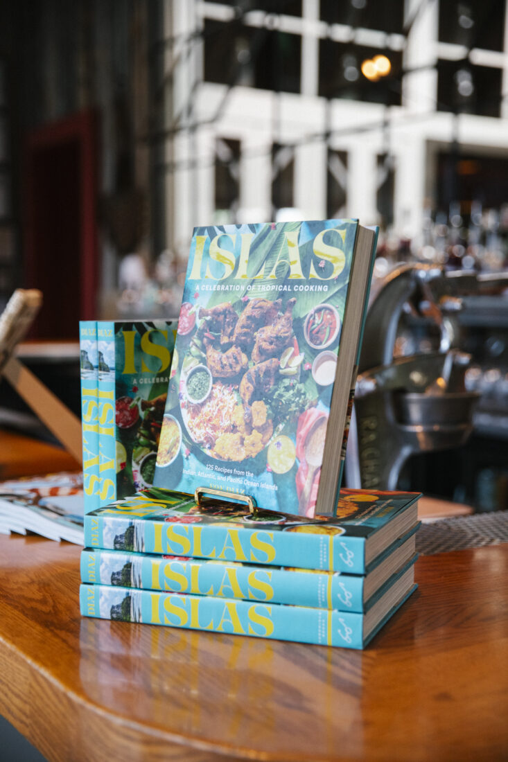 a stack of books on a bar top