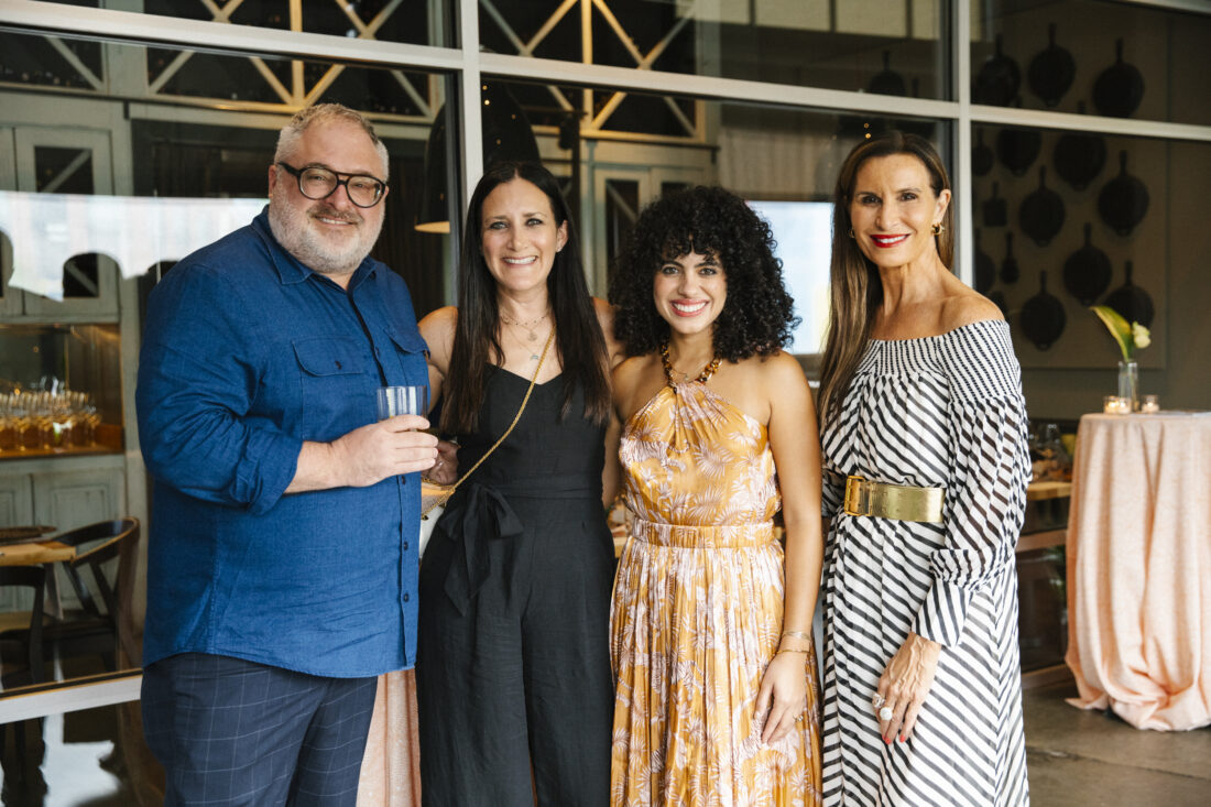 a man and three women posing together