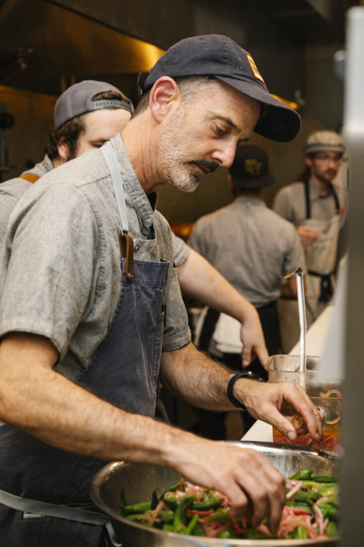 a chef preparing food on the line