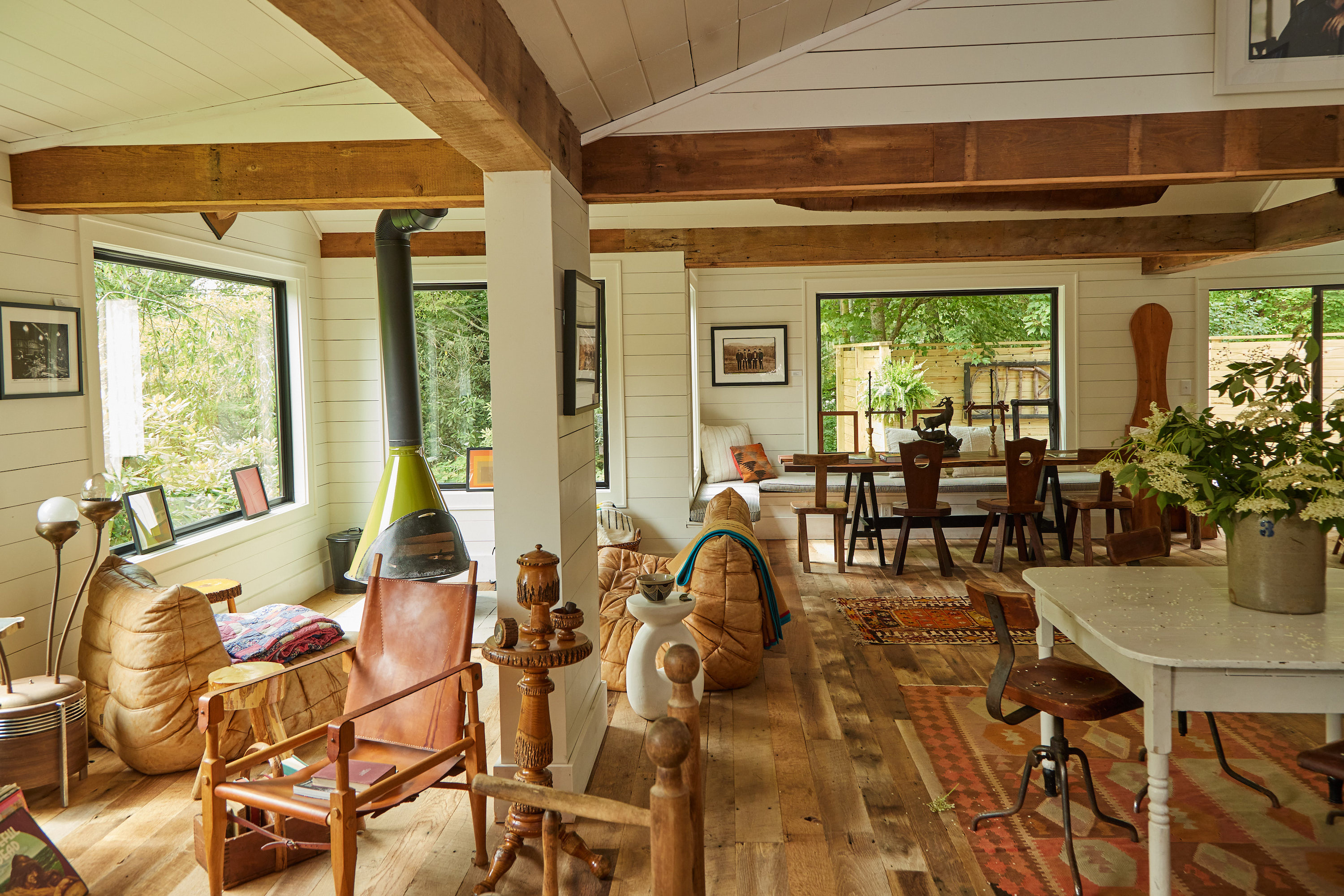 A lobby with wood details and a green fireplace