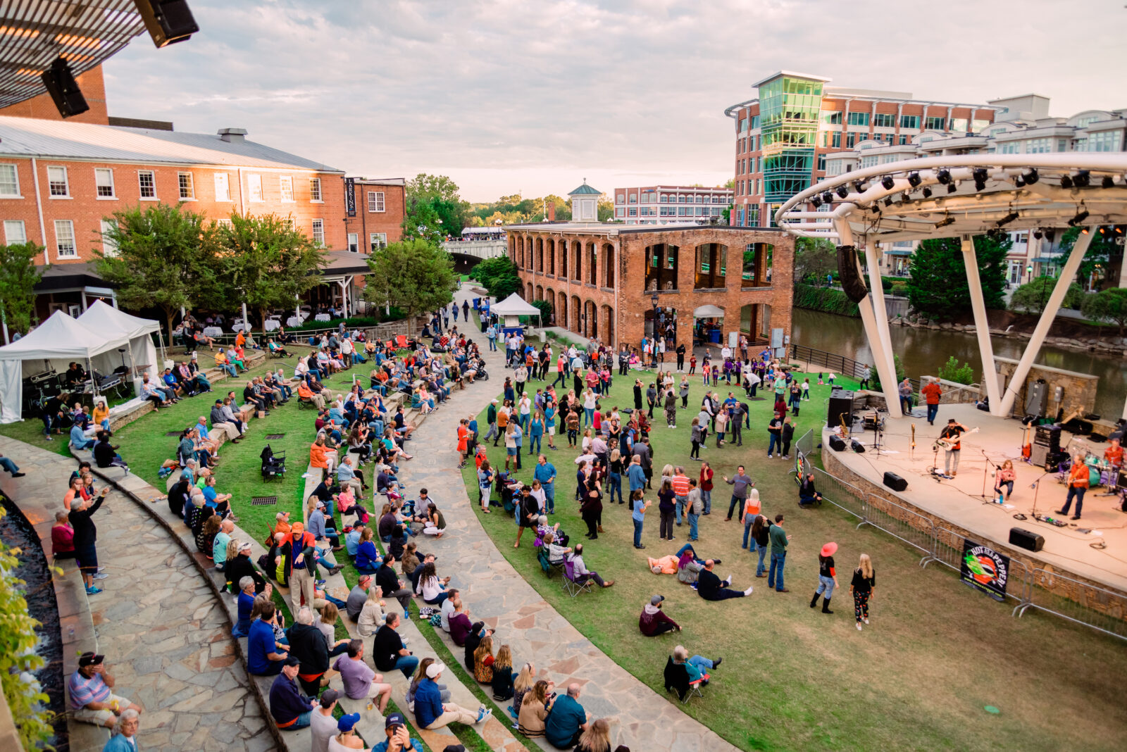 People gather by an amphitheater