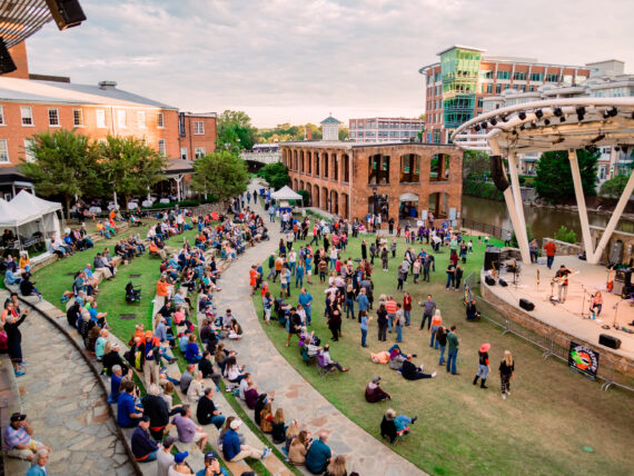 People gather by an amphitheater