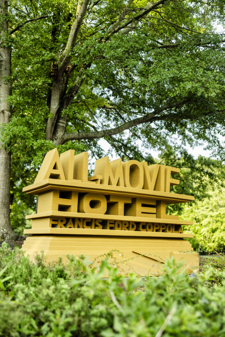 A gold sign of a hotel