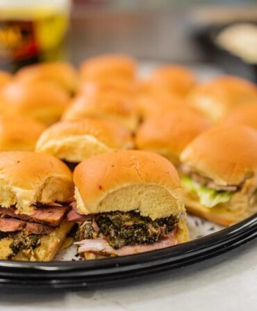 A platter of stuffed ham sandwiches