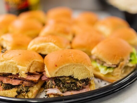 A platter of stuffed ham sandwiches