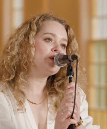 A woman singing into a microphone