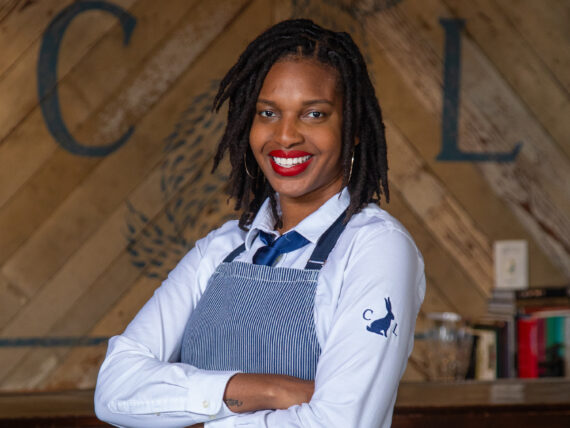 Erika Flowers stands with her arms crossed.