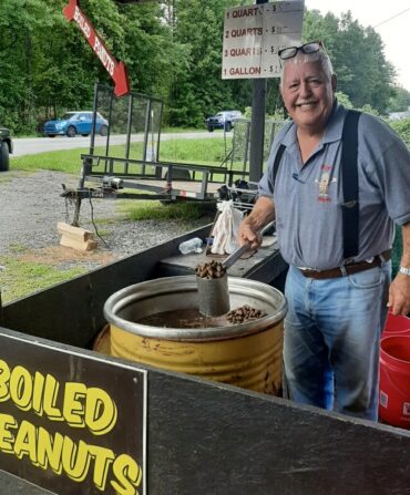 Michael Meaders with a scoop of boiled peanuts