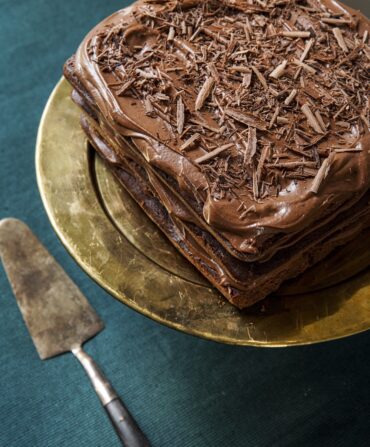 An aerial view of a triple-layer chocolate cake.